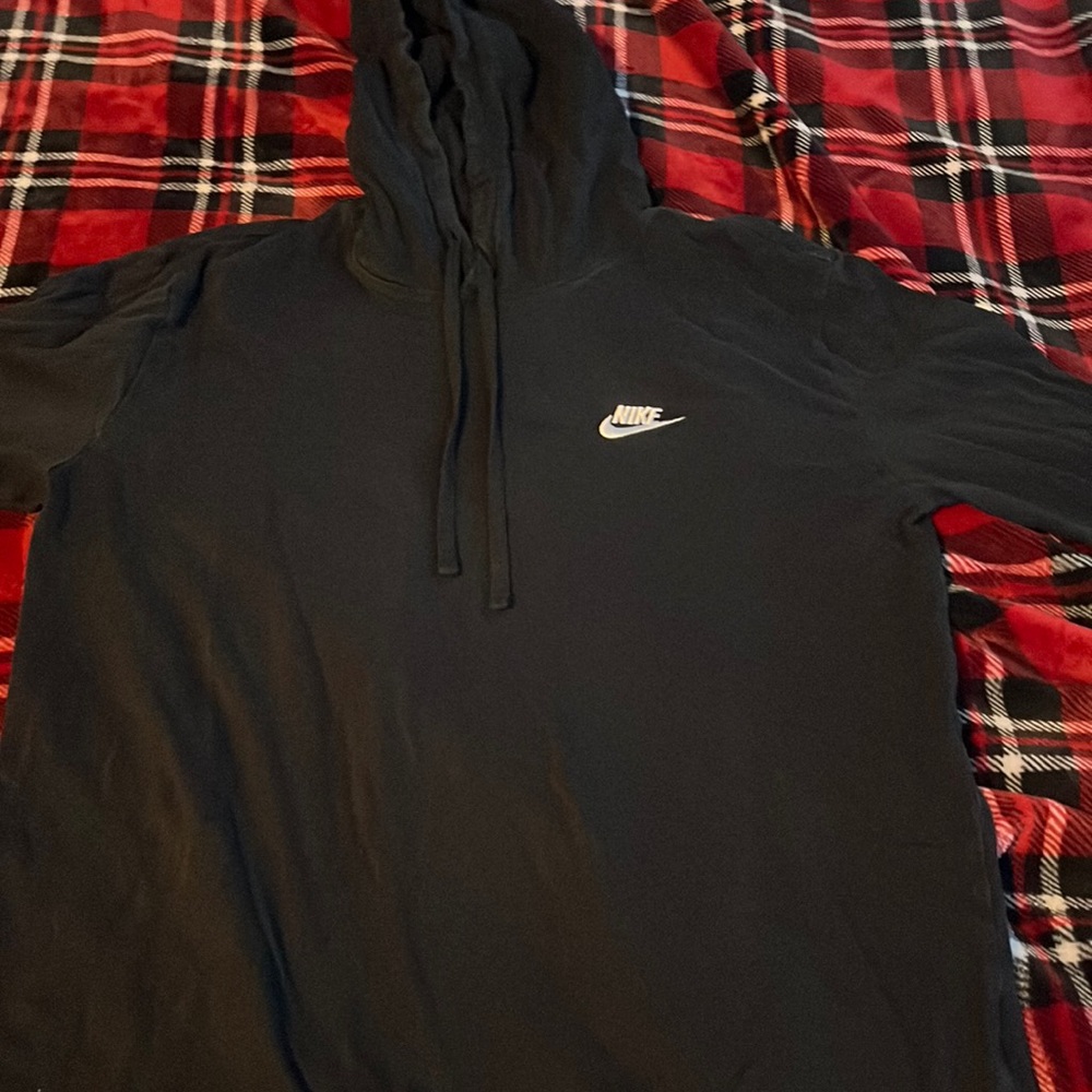 thin, black Nike sweatshirt